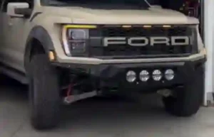 Front and rear bumpers of a Ford F150 truck, emphasizing their robust build and protective features. ADD The Ford F-150 SpareParts to be replaced -Accessories For Sale" [Alt text: Front and rear bumpers of a Ford F150 truck showcasing robust build and protective features, available at The Ford F-150 SpareParts. Browse Accessories For Sale